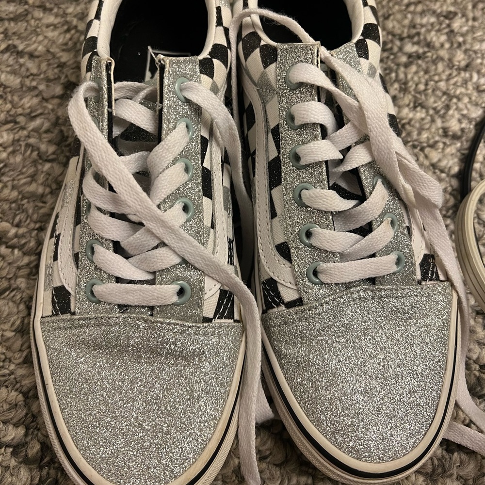 Brand new VANS sparkle. With black and white checks.  7.5. Fits closer to a 7.
